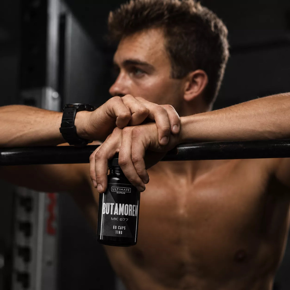 cinematic gym portrait with butamoren bottle